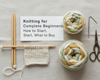 Knitting needles and yarn with a beginner's first knitted swatch in progress