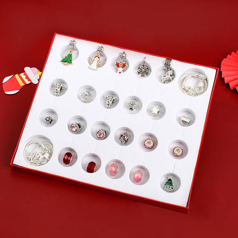a red box with a bunch of earrings in it