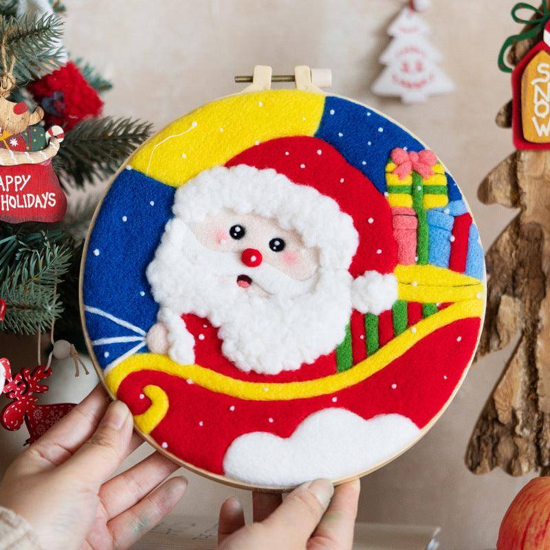 a person holding a christmas ornament with a santa clause on it
