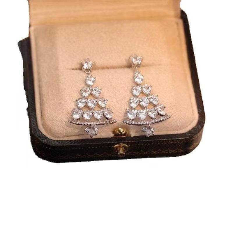 a pair of earrings in a box