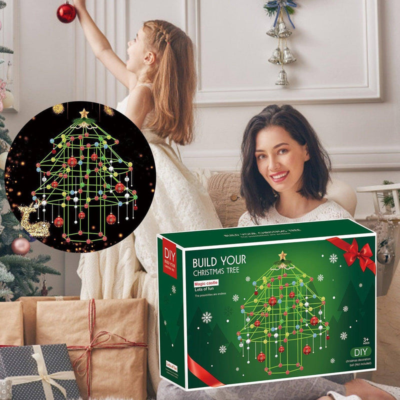 a woman and a girl sitting on a couch with a christmas tree puzzle