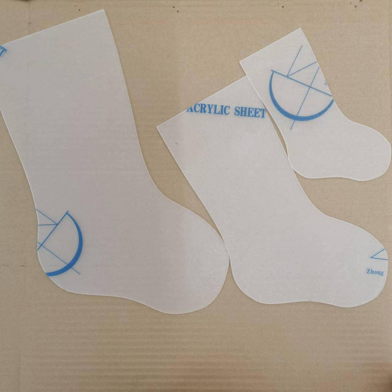 a pair of white socks sitting on top of a cardboard box