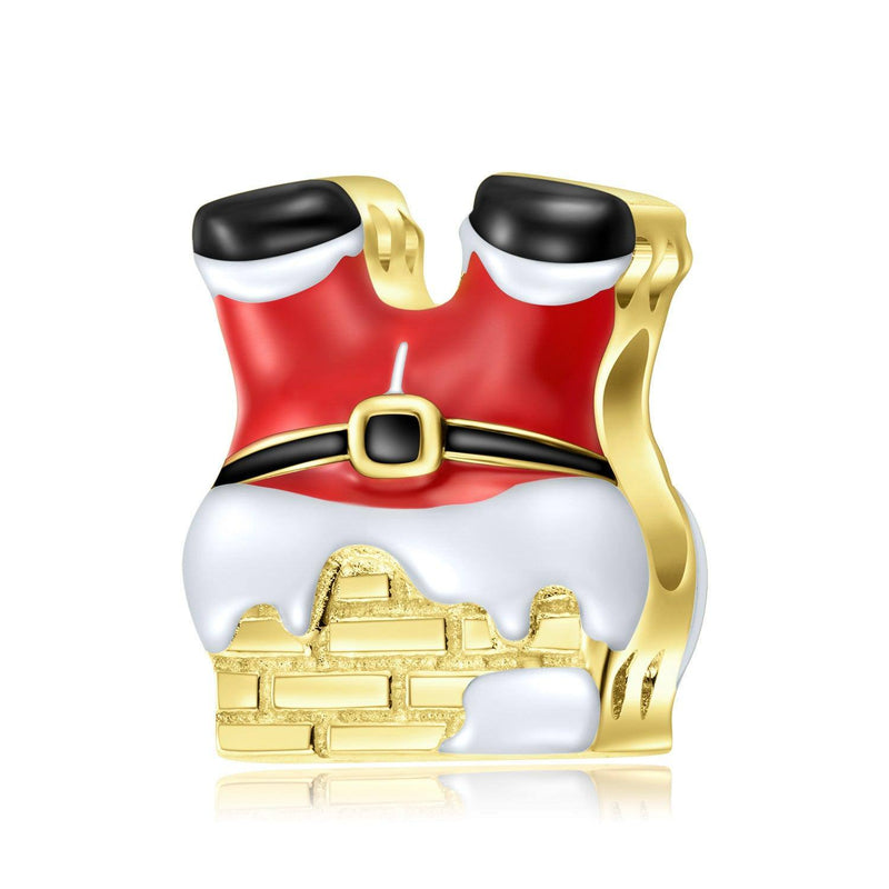 a santa clause figurine sitting on top of a pile of gold